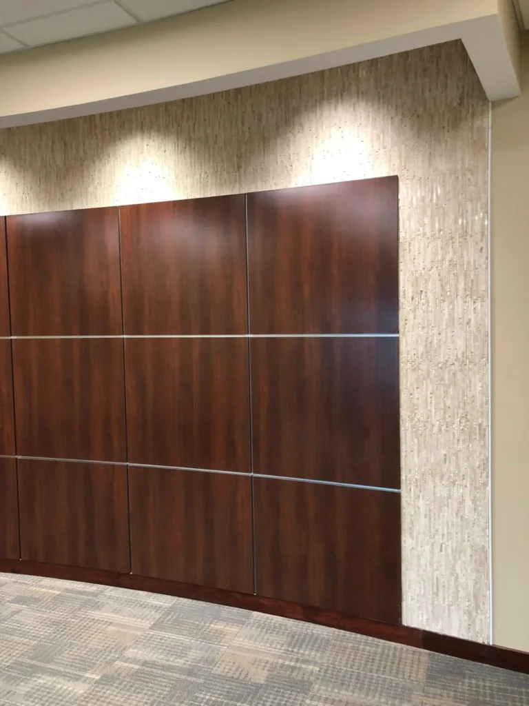 Textured ledger stone mosaic tile accent wall installation in a corporate office lobby renovation by DMtilellc in Ridgefield CT